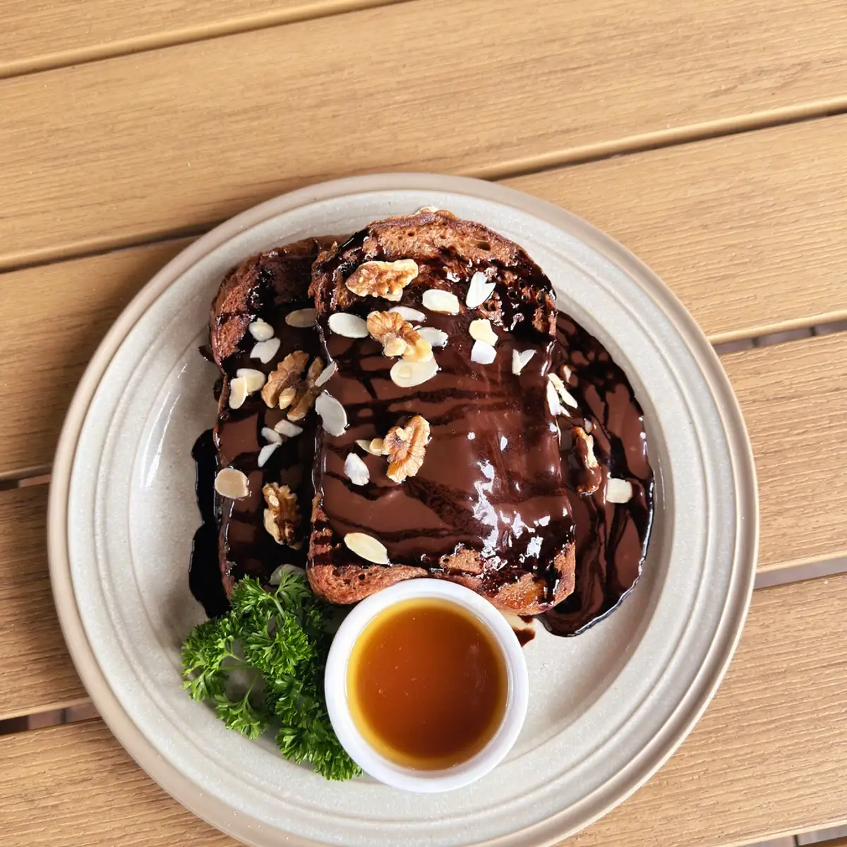 Choco French Toast with dark chocolate, almonds, walnuts and warm maple butter