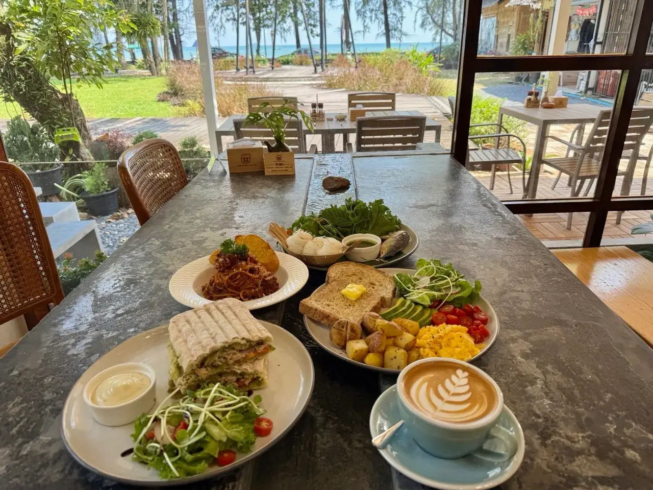 The stone water table, set for brunch — Thongyib Thongyod, Ao Nang